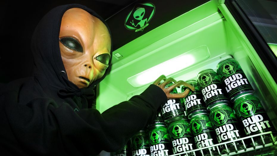 alien grabbing a bud light out of a fridge