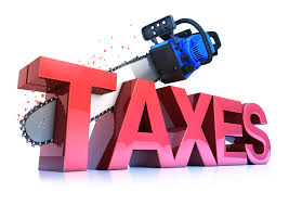 chainsaw cutting the word taxes